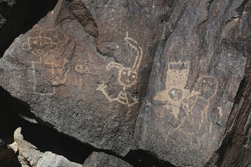 Rock texture with several ancient pictograms