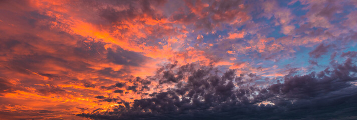 Fototapeta na wymiar Beautiful sunset sky. Pink and orange fluffy clouds. Atmospheric natural background.