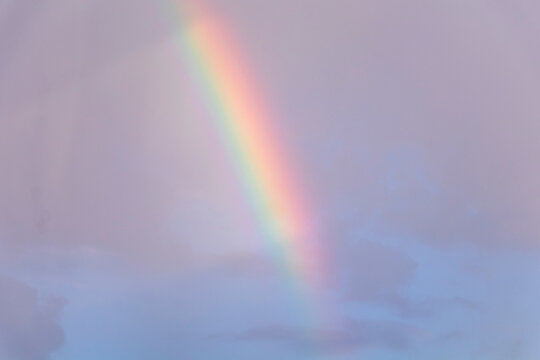Rainbow On The Cloudy Pink Sky