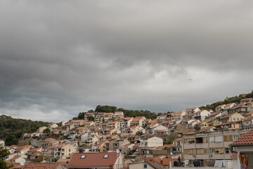 Obraz premium Beautiful old part of townwith a picturesque belltower in Sibenik, on the dalmatian coast in Croatia in winter time.
