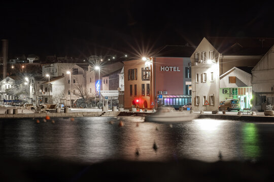 View of the city of Karlobag in the night winter hours. Waterfront view with bars and hotels visible.