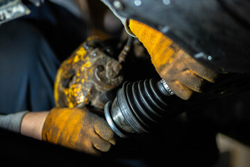 installation of the drive shaft of the joint and half shaft in the engine gearbox, a metal clamp on the rubber boot.
