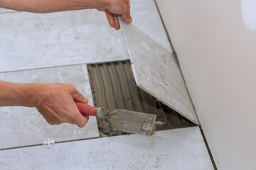Fototapeta na wymiar Ceramic tiles installation on adhesive home improvement, renovation