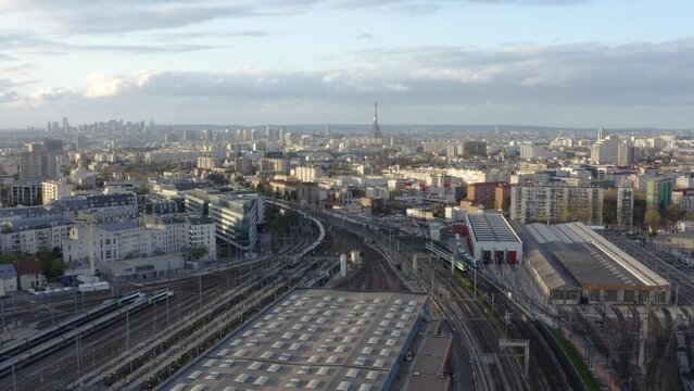 City famous train station rail ways aerial. Passenger Train Arriving On Station.  Train Station Aerial Drone. A drone flies over a train station. Aerial top view.