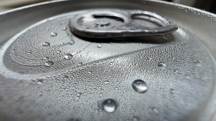 water drops on a metal surface tincan soda