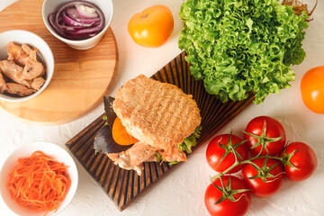 Fresh doner kebab in bun and ingredients on white background