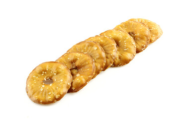 Cracker chips with sea salt isolated on white background. Round shape appetizers