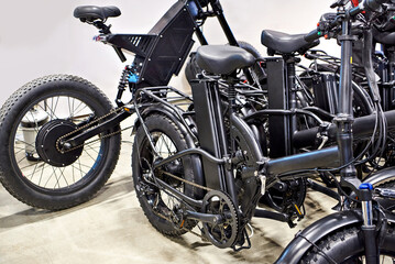 Black electric bicycles in shop