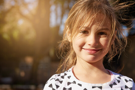Nothing but carefree days. Portrait of a little girl enjoying some time outdoors.