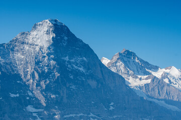 the peaks of Eiger with it's famous Nordwand in the Swiss Alps - obrazy, fototapety, plakaty