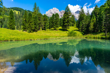 Landscape with lake in val gardena. Dolomites reflected in a body of water 