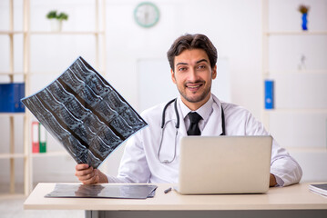 Young male doctor radiologist working in the clinic