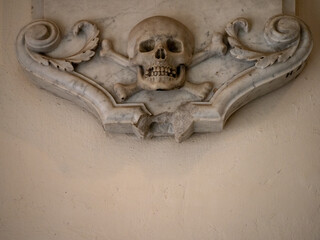 Stone skull with crossbones, symbol of death