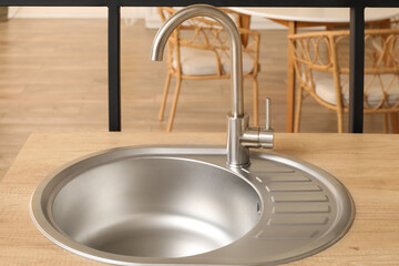 Wooden counter with sink in modern kitchen
