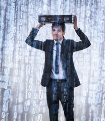 Binary downpour. Studio concept shot of a businessman being rained on by binary code.
