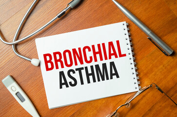 On a purple background a stethoscope with yellow list with text BRONCHIAL ASTHMA