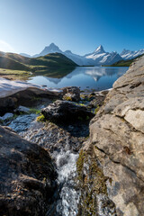 small creek at Bachalpsee with Schreckhorn on a beautiful summer morning