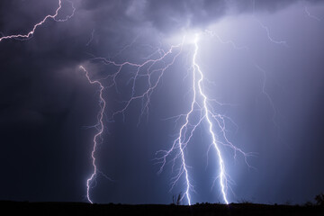 Dramatic lightning bolts strike in a thunderstorm