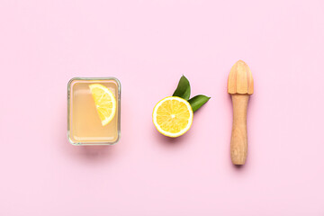 Composition with fresh lemon juice and wooden juicer on color background