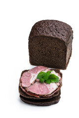 Pork brisket slices smoked meat on rye bread isolated on white