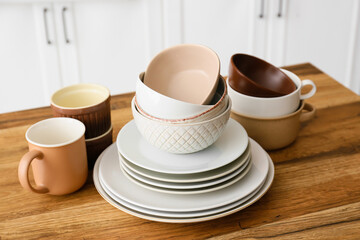 Set of clean tableware in kitchen