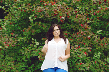 She loves the park. Shot of an attractive young woman enjoying a day in nature.