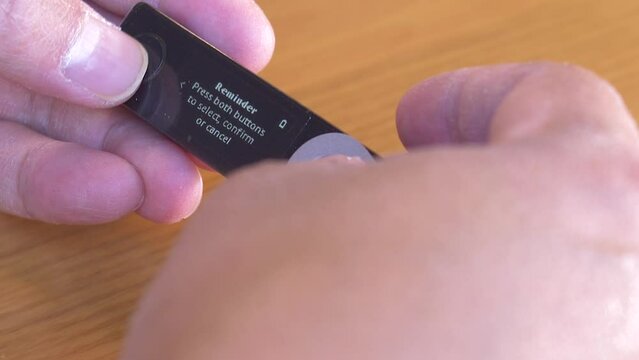 person configuring a ledger hardware cryptocurrency nano x hardware wallet