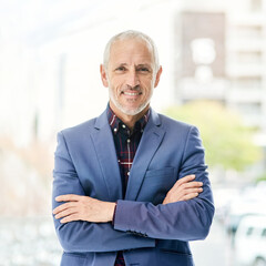 The look of a successful executive. Portrait of a mature businessman standing in a modern office.