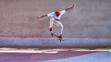 Change requires a leap of faith. Shot of a young man doing tricks on his skateboard at the skatepark. - Powered by Adobe