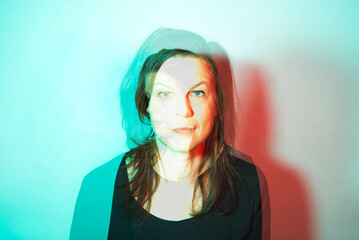 People: Double exposure portrait of a mid age woman