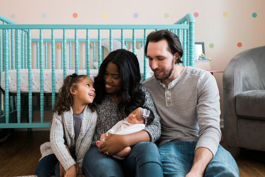 New family of four with newborn baby