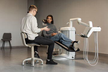 African american patient sitting in dentist chair