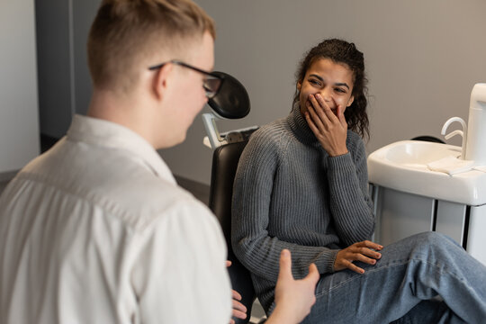 Patient smiles in dentist clinic