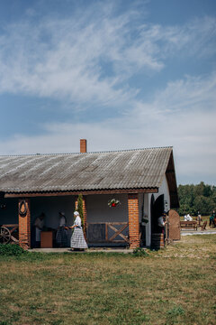 Woman on the background of the barn