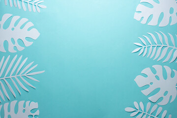 Fototapeta na wymiar Tropical leaf pattern. Various paper leaves on a pastel background. art. Flat lay, top view. Background on light blue background. Lent background, summer mood