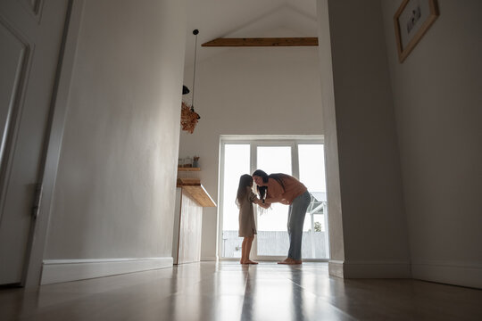 Mother scolding daughter in kitchen