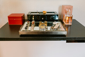 Men's vanity with jewelry and perfume