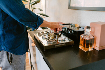 Man choosing accessories at his vanity