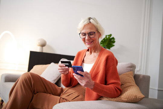 Senior woman paying for purchases online,