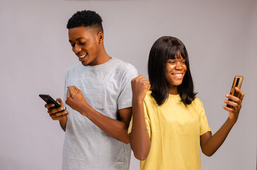two africans using there cellphone and feeling amazing