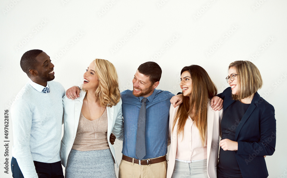 Poster this bunch are real close. studio shot of a group of work colleagues standing with their arms around