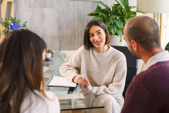 Sexologist giving advice to couple during visit