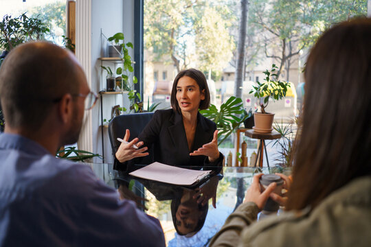 Couple listening to advice of sexologist during visit