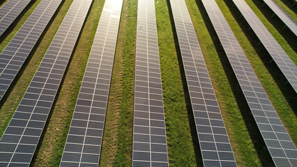 Aerial shot top view of solar panel of solar farm, small power plant generate electrical from solar energy, Green energy concept
