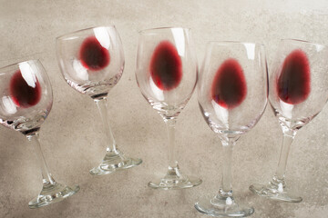 Red wine in transparent wine glasses on a betton background. Bojole nouveau, wine bar, winery,...
