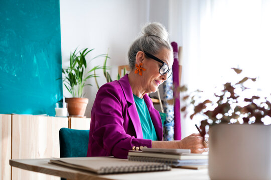 Stylish mature woman working in studio