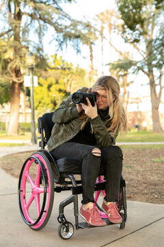 Differently Abled Woman Takes a Photo in a Park