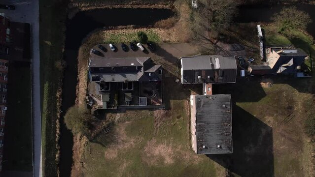 Aerial perspectives of former youth prison facility, now abandoned waiting for demolition and refurbishment of the moated plot field in a residential neighbourhood of Zutphen, The Netherlands