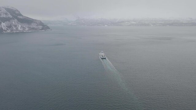A Ferry Sailing Olderdalen to Lyngseidet On A Foggy Winter. Kafjord, Troms, Norway. - Aerial