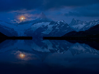 rising full moon over Schreckhorn and Bachalpsee near Grindelwald